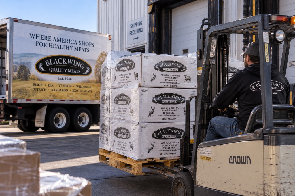 Blackwing employee moving pallet of wholesale order boxes at the shipping and receiving dock